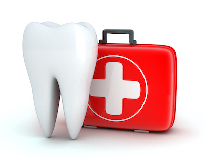 Tooth next to a first aid kit