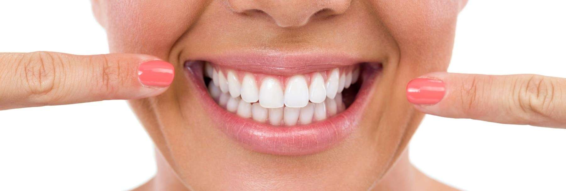 A smiling woman with white teeth