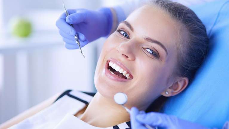 Woman getting dental crowns in Charlotte NC