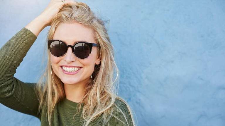 Blonde girl smiling in sunglasses, charlotte nc