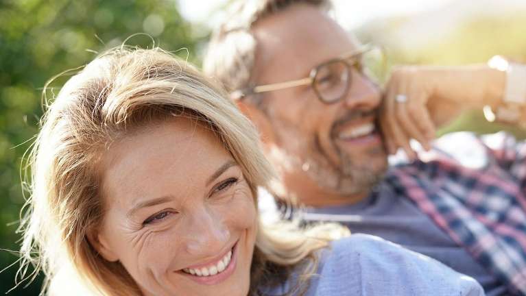 A couple laughing | Dental Implants in Charlotte NC