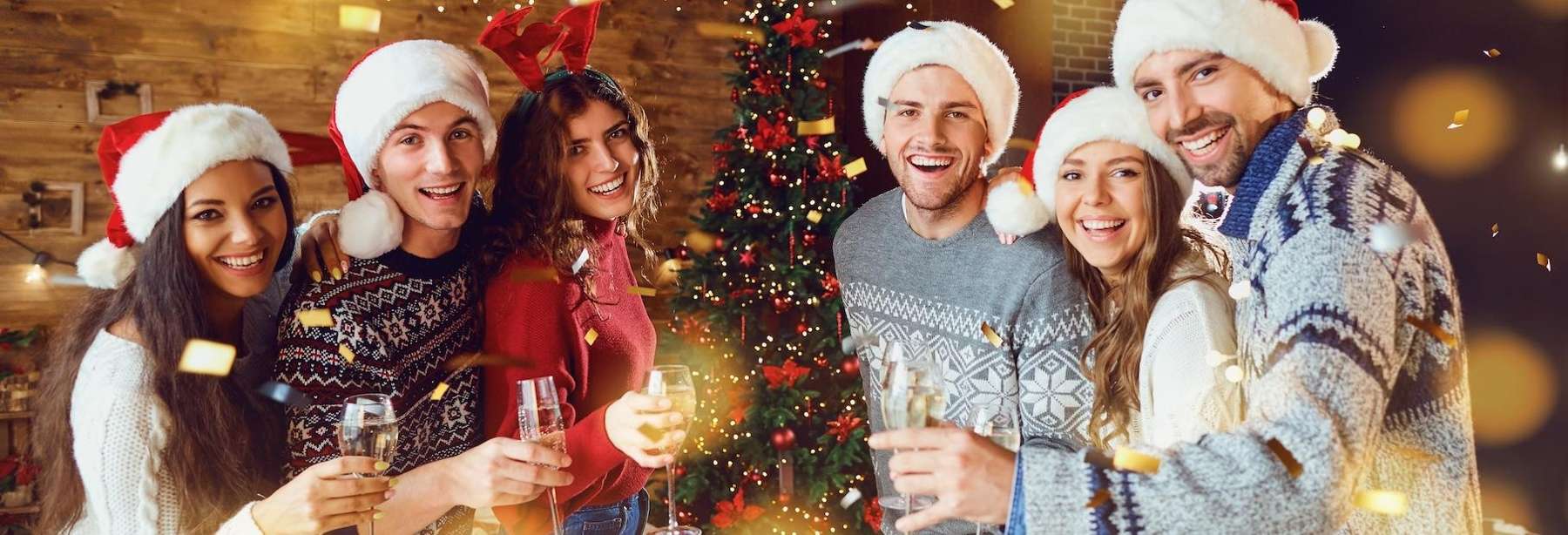 A group of friends around the Christmas tree